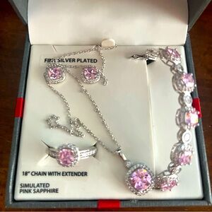 Fine silver plated 18” chain with extended simulated pink sapphire.